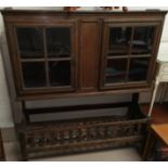 a 19th century continental wall cabinet with 2 glazed doors with associated lattice trough base