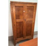 A 1930's oak part fitted wardrobe with 2 doors