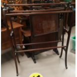 An Edwardian shaped mahogany towel rail, a folding 2 height cake stand; an Art Deco firescreen and 2