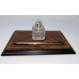 An inlaid walnut desk set with silver dip pen and inkwell