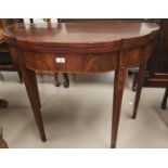 An early 19th Century scalloped demi-lune mahogany fold over tea table with inlaid decoration and