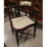 An Edwardian inlaid corner armchair