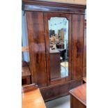 An Edwardian crossbanded figured mahogany 3 piece bedroom suite of mirror door wardrobe, dressing