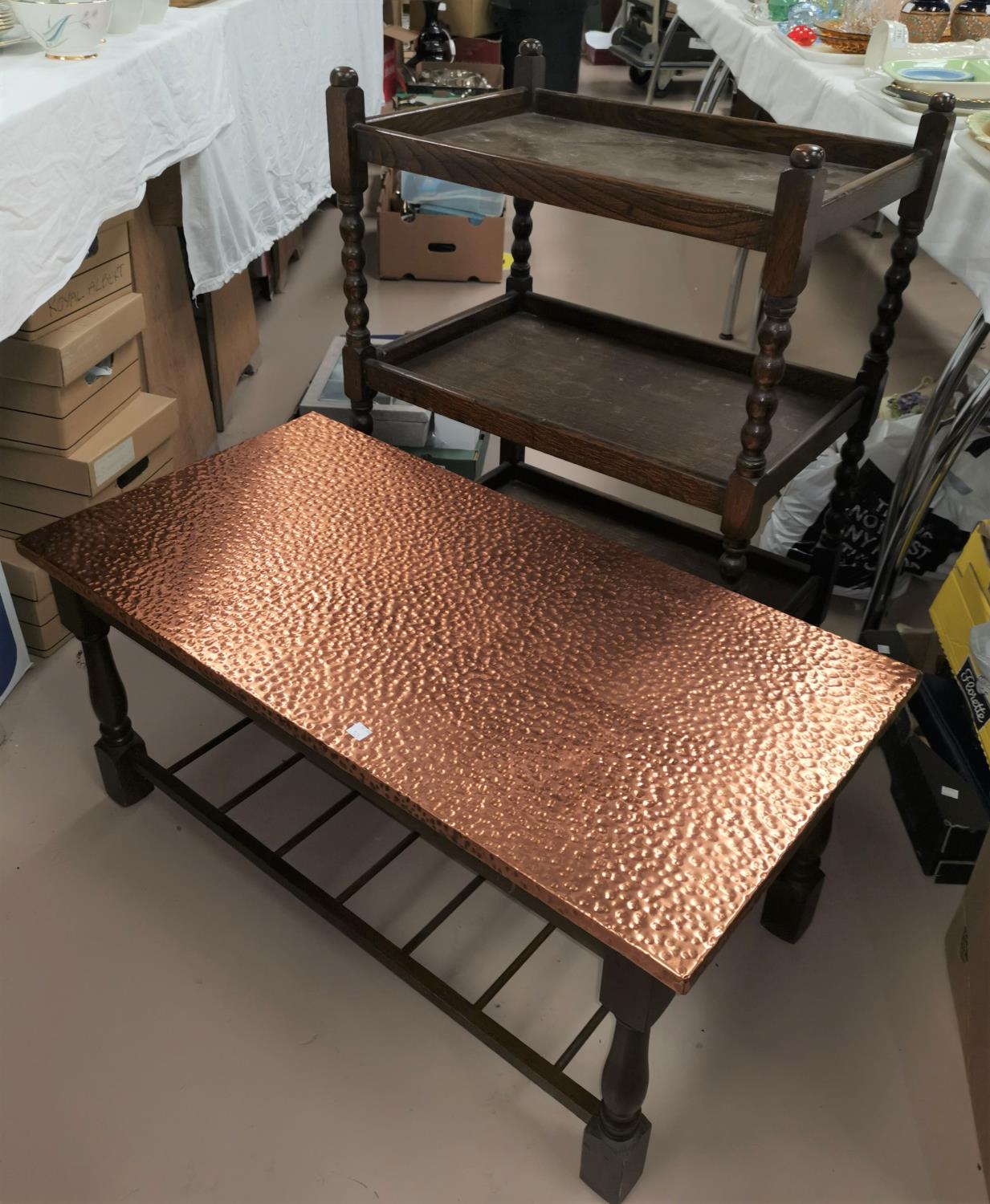 A 1930's oak 3 height tea trolley; a coffee table with copper top