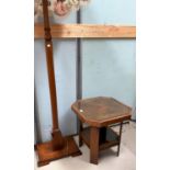 An Art Deco walnut coffee table, the top with canted edges, shelf below; an Art Deco lamp on stepped