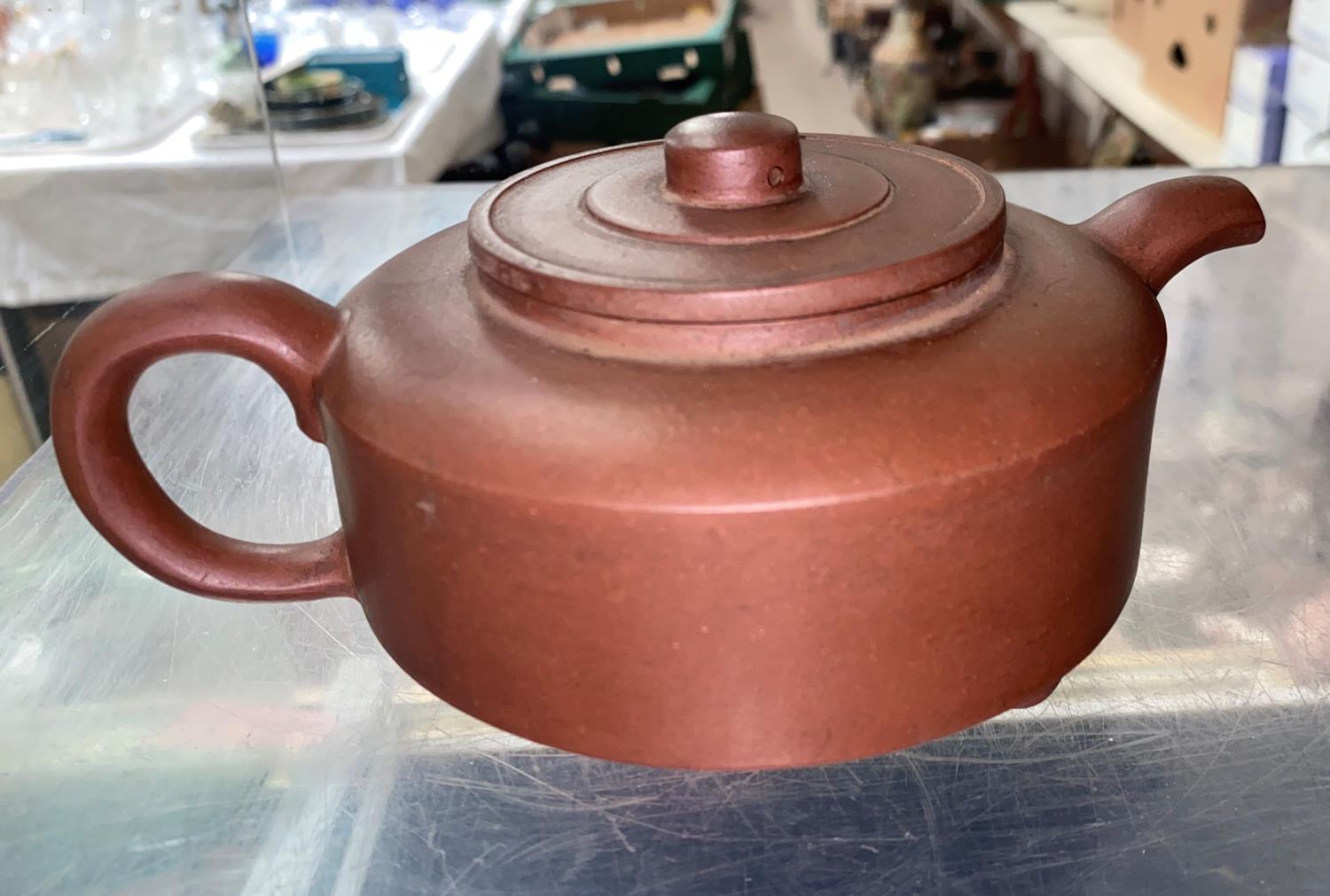 A Chinese Yixing terracotta coloured stoneware teapot of squat circular form, square impressed seal - Image 2 of 4