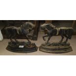 A pair of painted cast metal doorstops in the form of horses