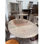 A modern Ercol dining table 'Silver Mist', with 2 spare leaves, extended length 280 cm, with 6