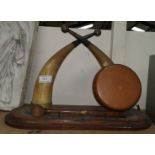 A dinner gong formed from 2 horns on wooden plinth; a small turned mahogany plant stand