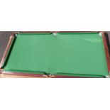 A table top size snooker table and accessories