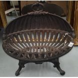 A cast iron classical style fire basket