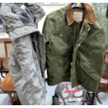 An extreme cold weather military style jacket Alpha industry and another similar