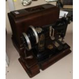A vintage sewing machine by Wheeler & Wilson, in original case
