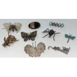 A selection of brooches, mainly butterflies, spider etc