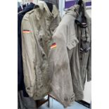 Two military style jackets with German patches and 2 pairs of goggles