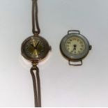 A 1930's ladies 9 carat hallmarked gold wristwatch, octagonal shaped on brown strap (no glass); a