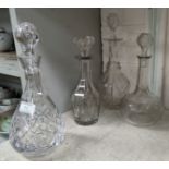 A cut glass decanter and 3 others