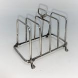 A hall marked silver rectangular four division wire work hall marked silver toast rack Birmingham 1