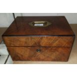 A Victorian walnut jewellery box with inset brass handles and fitted interior