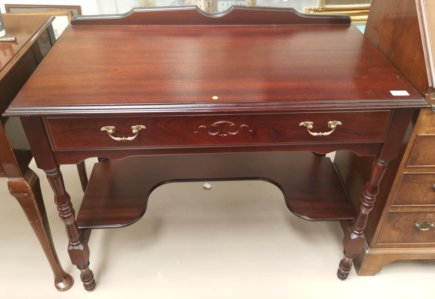 A mahogany reproduction side/writing table