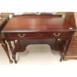 A mahogany reproduction side/writing table