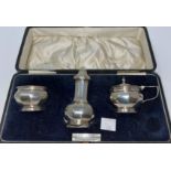 A 3 piece silver cruet set with ribbed decoration, boxed, Birmingham 1923, 2.5 oz