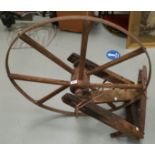 A vintage wood and metal waggon wheel