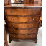 A reproduction mahogany 5 height chest of drawers with serpentine front; a walnut chest of 3 long