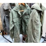 A USAF 1955 military field jacket Abe L Greenberg Co Inc Sig Regt; a military jacket with cloth