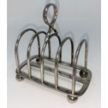 An arched hall marked silver four division toast rack on ball feet Sheffield 1930 5.5oz (172gms)