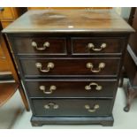 A mahogany dwarf chest in the Georgian style with 3 long and 2 short drawers