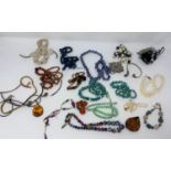 A selection of necklaces, millefiore beads etc