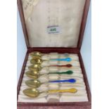 A Boxed set of six Swedish individually coloured and enameled coffee spoons stamped 925s