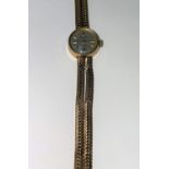 A ladies 9 carat wristwatch on 9 carat mesh strap, 22.8 gm
