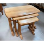 An Ercol Windsor style nest of 3 occasional tables