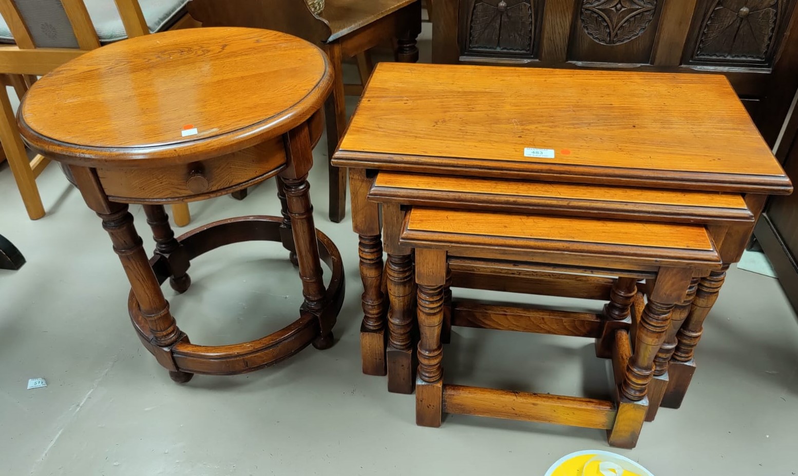 A nest of 3 rustic occasional tables; an oak circular occasional table