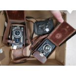 A Yashica 44 TLR camera; 2 Voigtlander examples