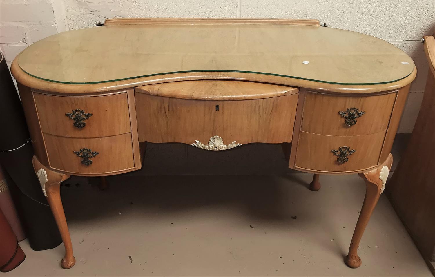 A walnut dressing table with 5 drawers