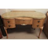 A walnut dressing table with 5 drawers