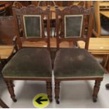 An Edwardian set of 6 dining chairs in carved oak, with brown dralon seats and backs