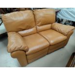 A tan coloured two seater settee with one reclining side