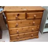 A modern pine chest of 3 long and 2 short drawers