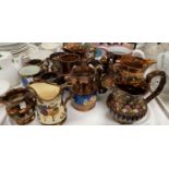 A Victorian collection of 13 large copper lustre jugs