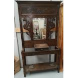 A Victorian carved oak hallstand with mirror back