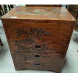 An oriental small carved side cabinet with hinged top and 3 drawers