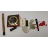 Three oriental hardstone pendants; a 1930's travelling clock; vintage advertising calendars; etc.