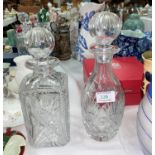 A heavy cut glass square decanter; another similar