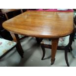 An Edwardian inlaid mahogany wind out dining table, 'D' end with 2 spare leaves, on square