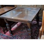 A 1930's oak draw leaf dining table on bulbous lets and 2 Carolean style chairs