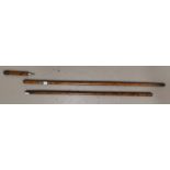 A stained and grained wood walking cane with inset pencil; and another (both a.f.)